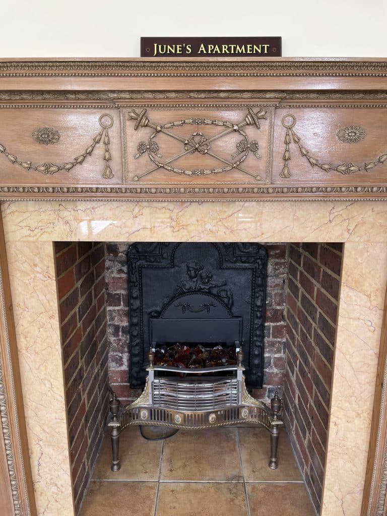 Junes-west-wing-apartment-fireplace