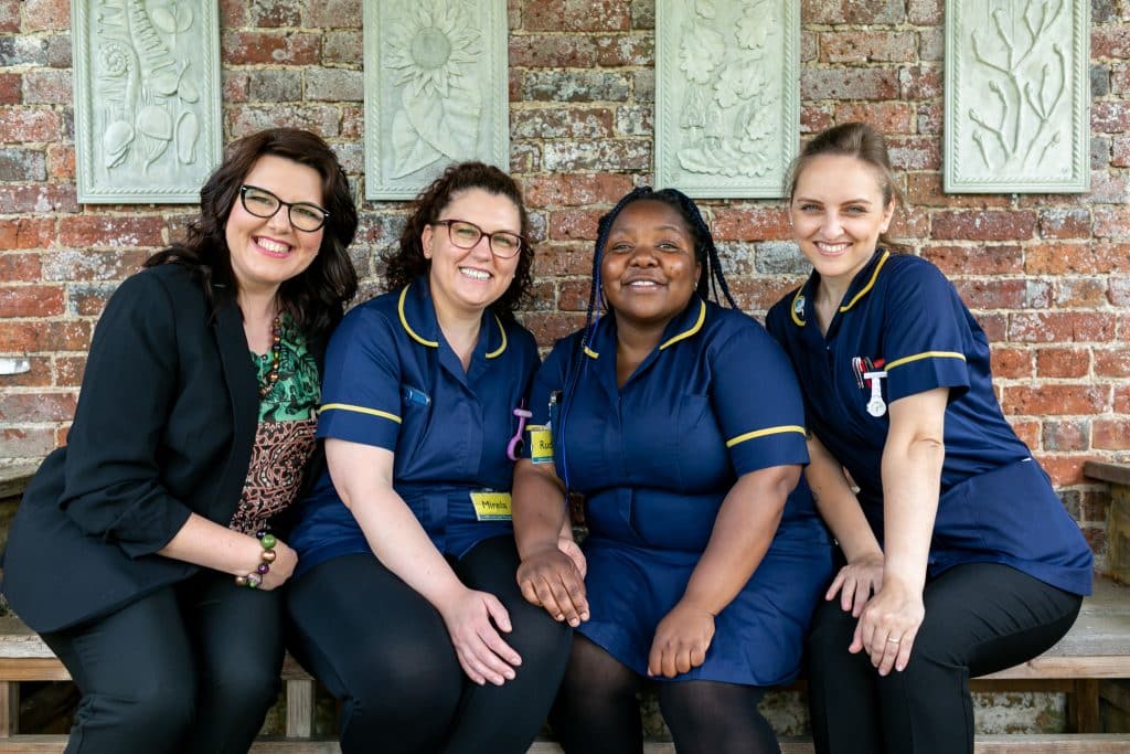 Birtley House Nursing Team Sitting Together Smiling